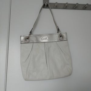 White and silver Coach purse